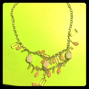 A pink and silver antique necklace. Made by hand.